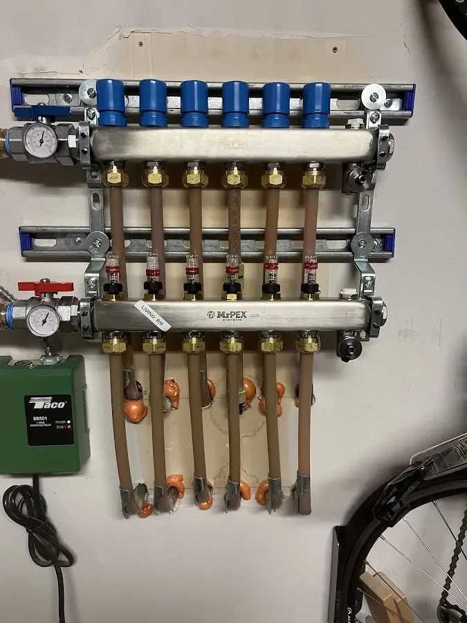 Plumber performing Water Heater Repair at a residential property in Elko New Market